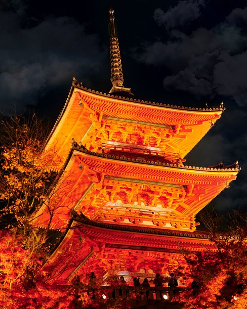 Free A vibrant illuminated pagoda against a night sky in Kyoto, showcasing traditional Japanese architecture. Stock Photo