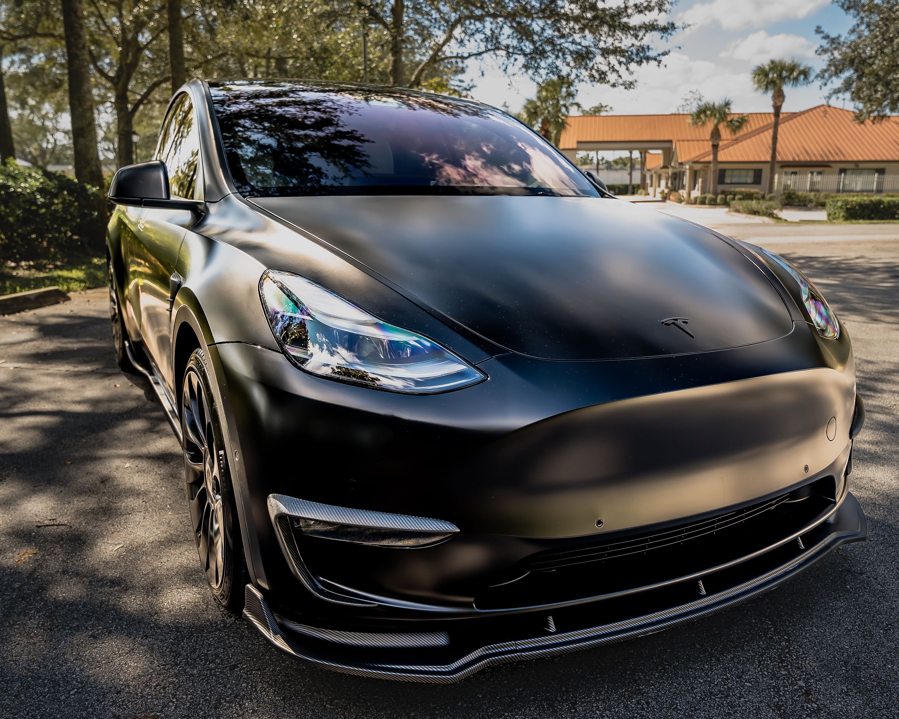 Close-Up Shot of Black Car Parked on Concrete Floor