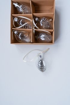 Stylish glass Christmas ornaments with feather details, perfect for holiday decoration.