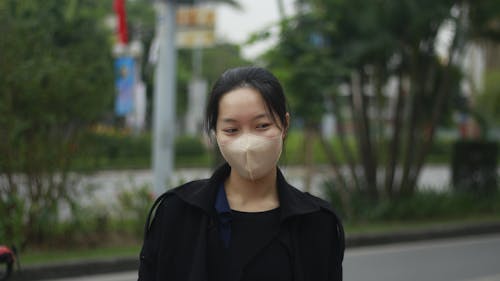 Woman Wearing Facemask Looking Sideways