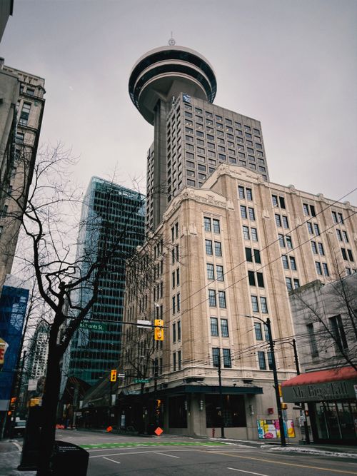 Free Urban architecture featuring the Vancouver Lookout Tower against a cloudy sky in downtown Vancouver. Stock Photo