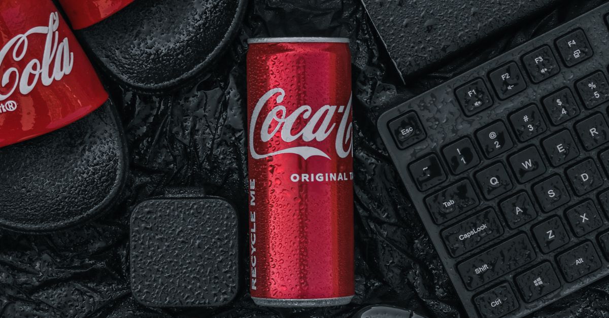 Coca Cola Computer Coca Cola Can between Computer Items · Free Stock Photo
