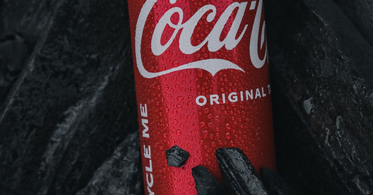 Cola Rocks Wet Coca-Cola Can among Black Rocks · Free Stock Photo