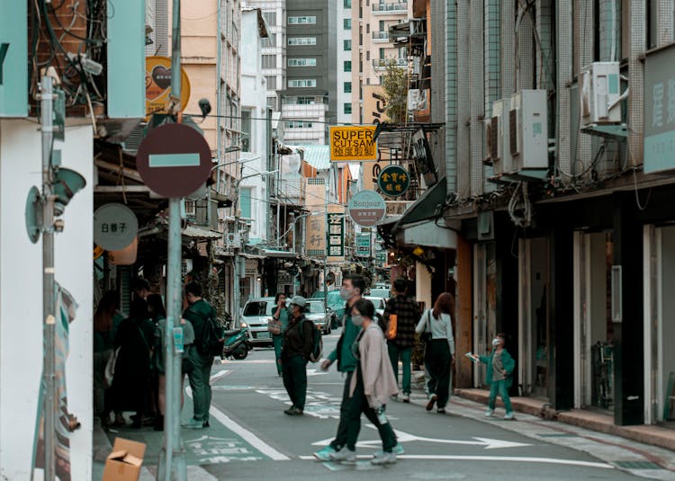 People Walking On A Street In A City