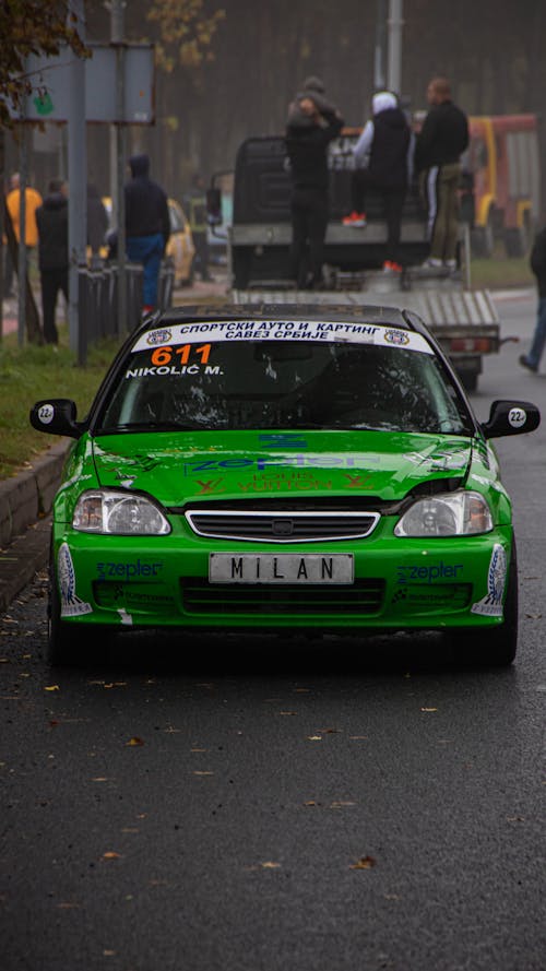 Green Race Car Parked on the Road