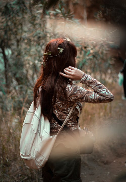 Woman Carrying a Backpack