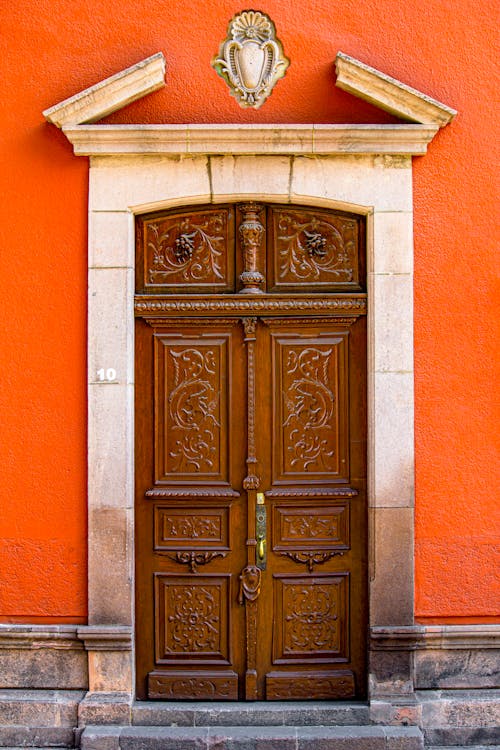 Free Brown Wooden Door on Concrete Building Stock Photo