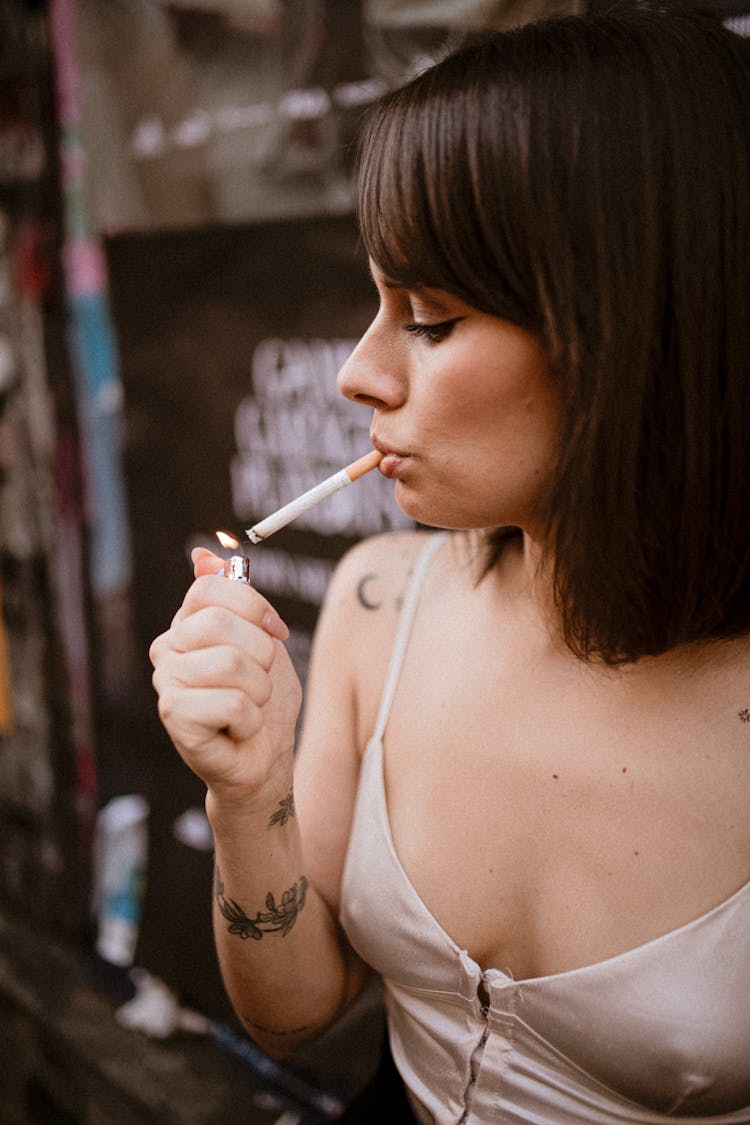 Woman Lighting A Cigarette 