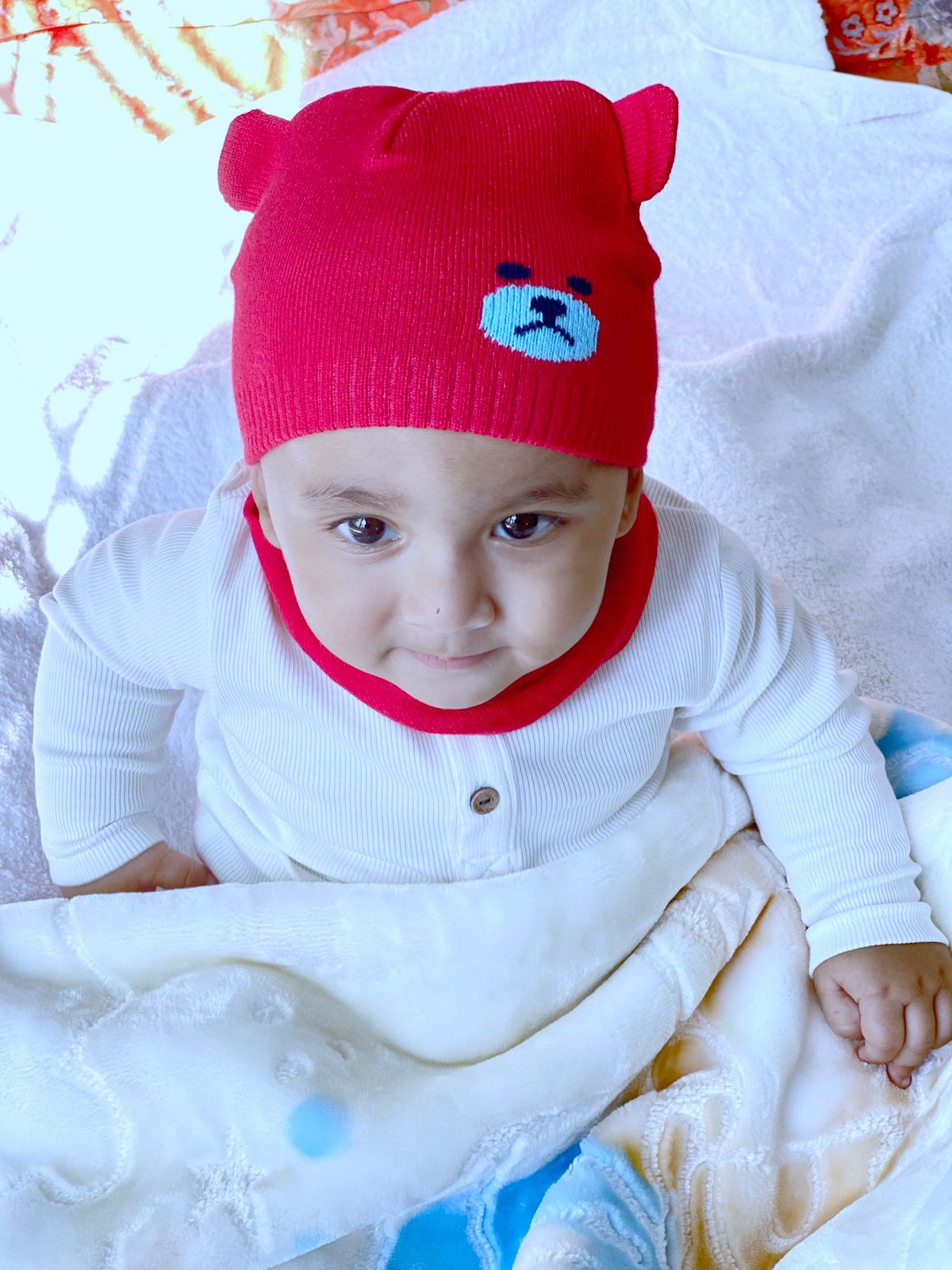 Baby in a red beanie