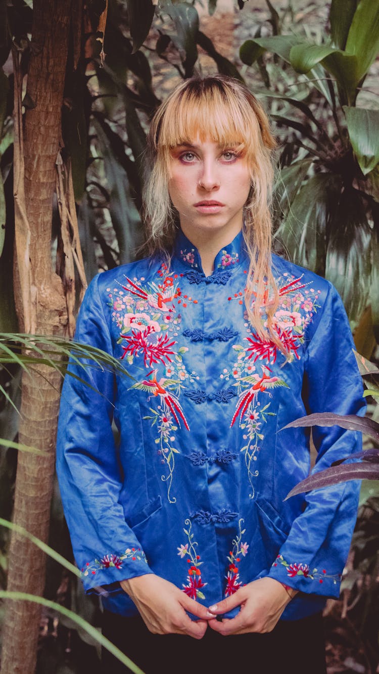 Woman In Embroided Satin Blouse