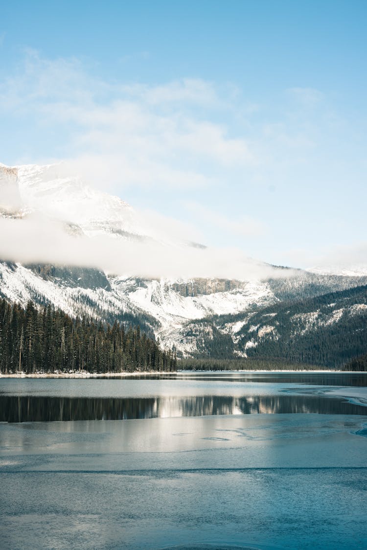 A Snowcapped Mountain Near Frozen Lake During Winter