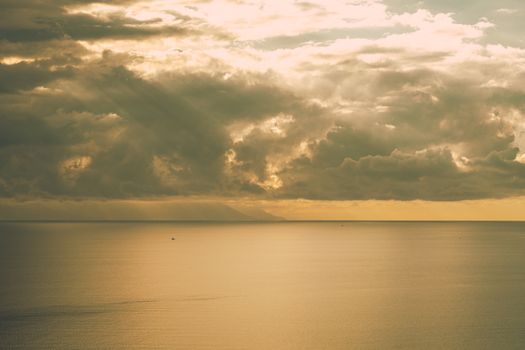 Sunlight Shining through Clouds on Sea Surface