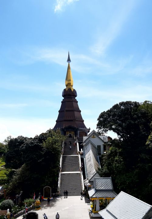 Free Vertical shot of the iconic Doi Inthanon Pagoda in Thailand against a bright blue sky, a popular tourist attraction. Stock Photo