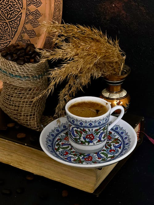 A Cup of Coffee Beside Decorative Plant