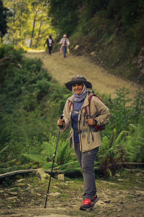 Free A woman smiling while hiking the scenic trails of Annapurna, Nepal. Stock Photo