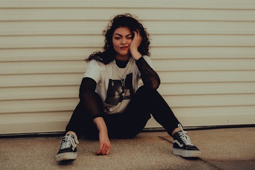 Woman Sitting on the Ground