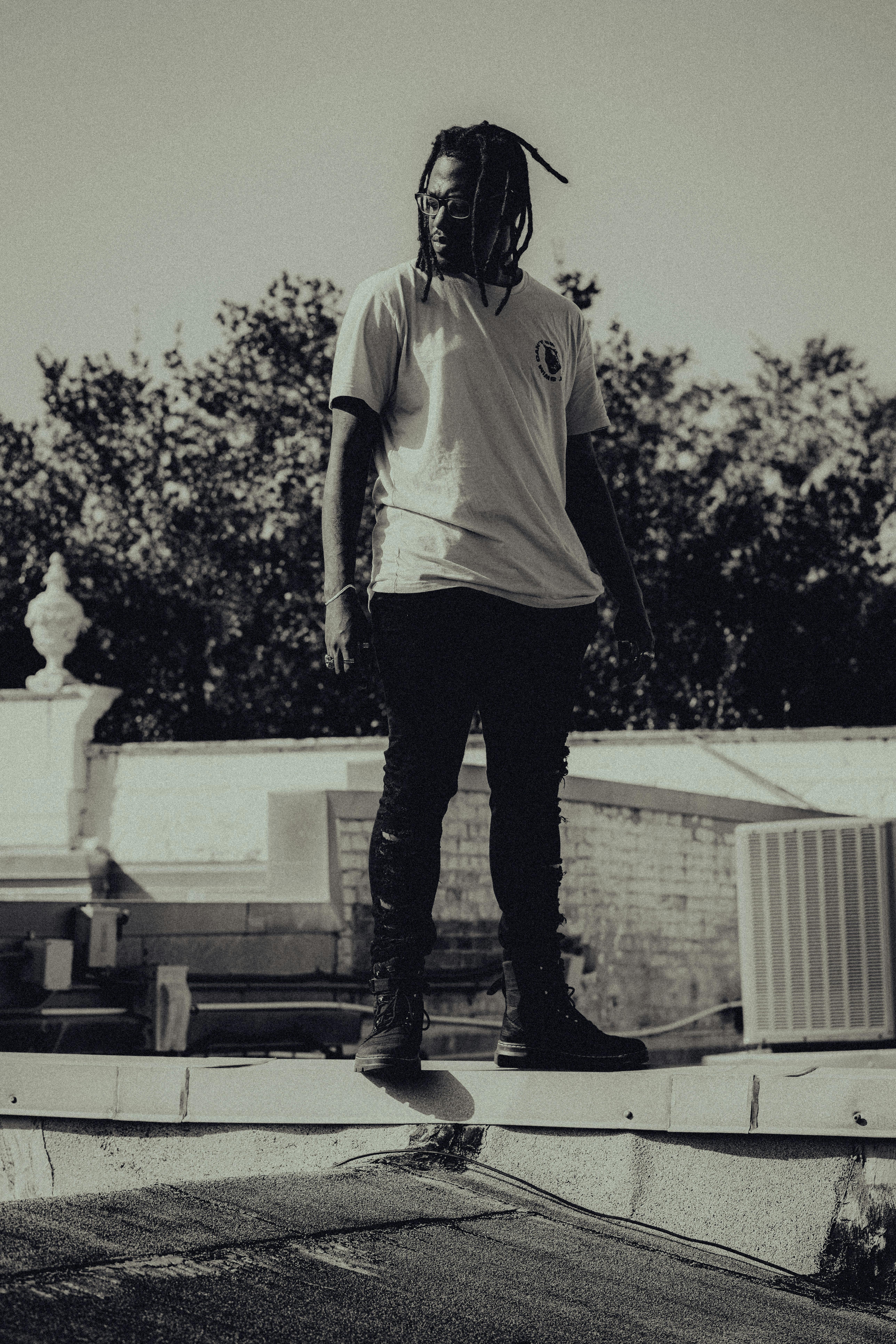 a man standing on top of a roof