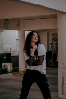 Woman in urban area showcasing modern fashion with a smile