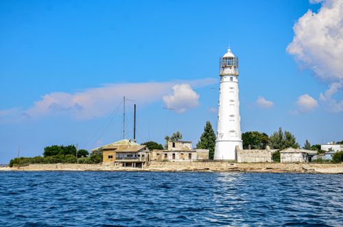 Free Tarkhankut Lighthouse with blue skies and waters in Crimea, Russia. Stock Photo