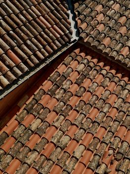 Detailed view of terracotta roof tiles showcasing a rich texture and pattern.