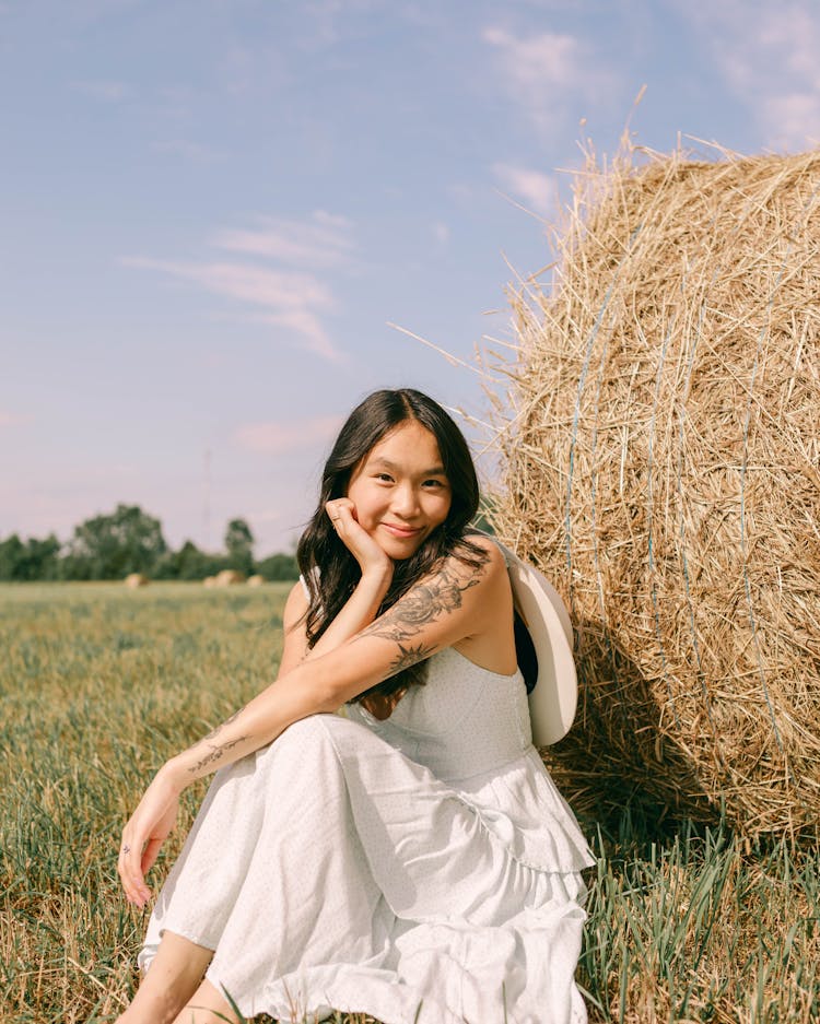 Woman In White Dress In Countryside In Summer