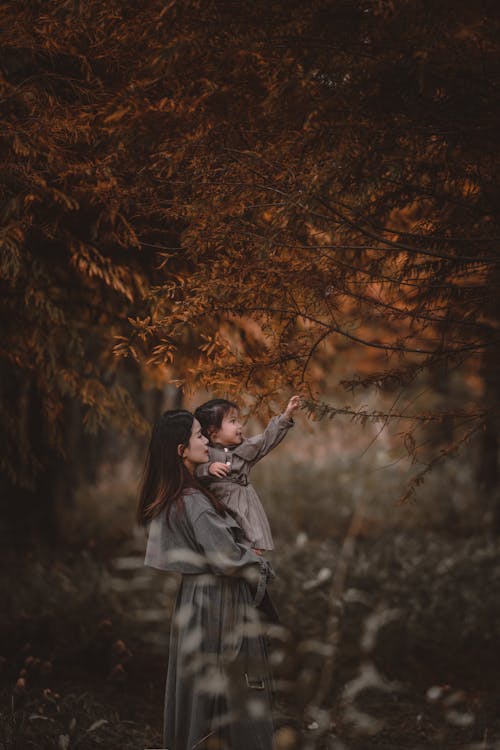 A Woman with her Daughter in a Forest 