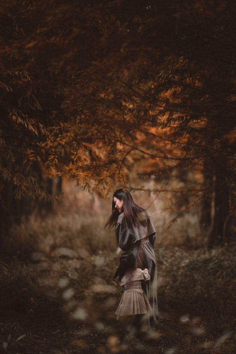 Mother and child walking in a peaceful forest