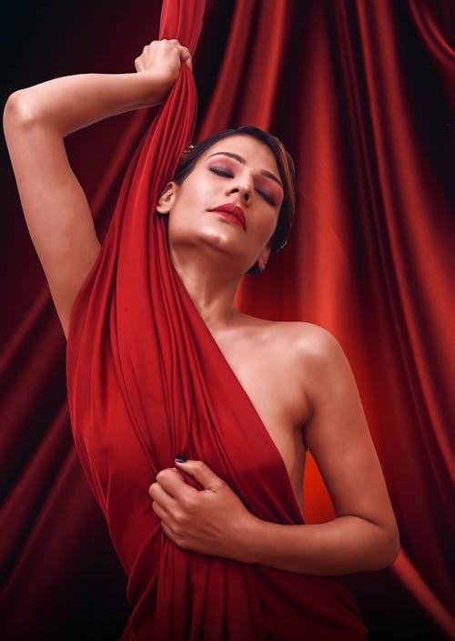 Beautiful Woman Covering Herself with Red Cloth