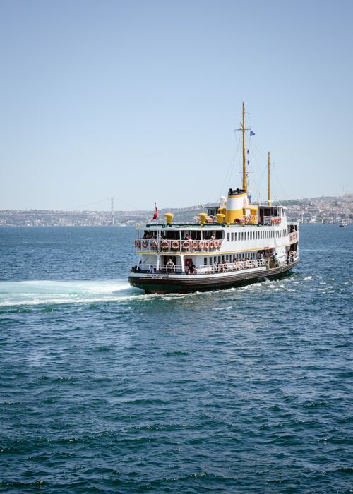 Free A scenic ferry navigating through blue ocean waters on a sunny summer day. Stock Photo
