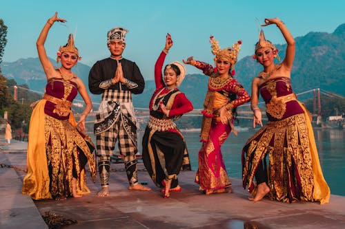 Group of Dancers Wearing Traditional Clothes and Standing in Dance Poses