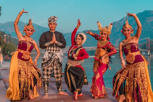 Group of Dancers Wearing Traditional Clothes and Standing in Dance Poses