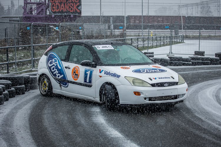 White Race Car Drifting On Race Track