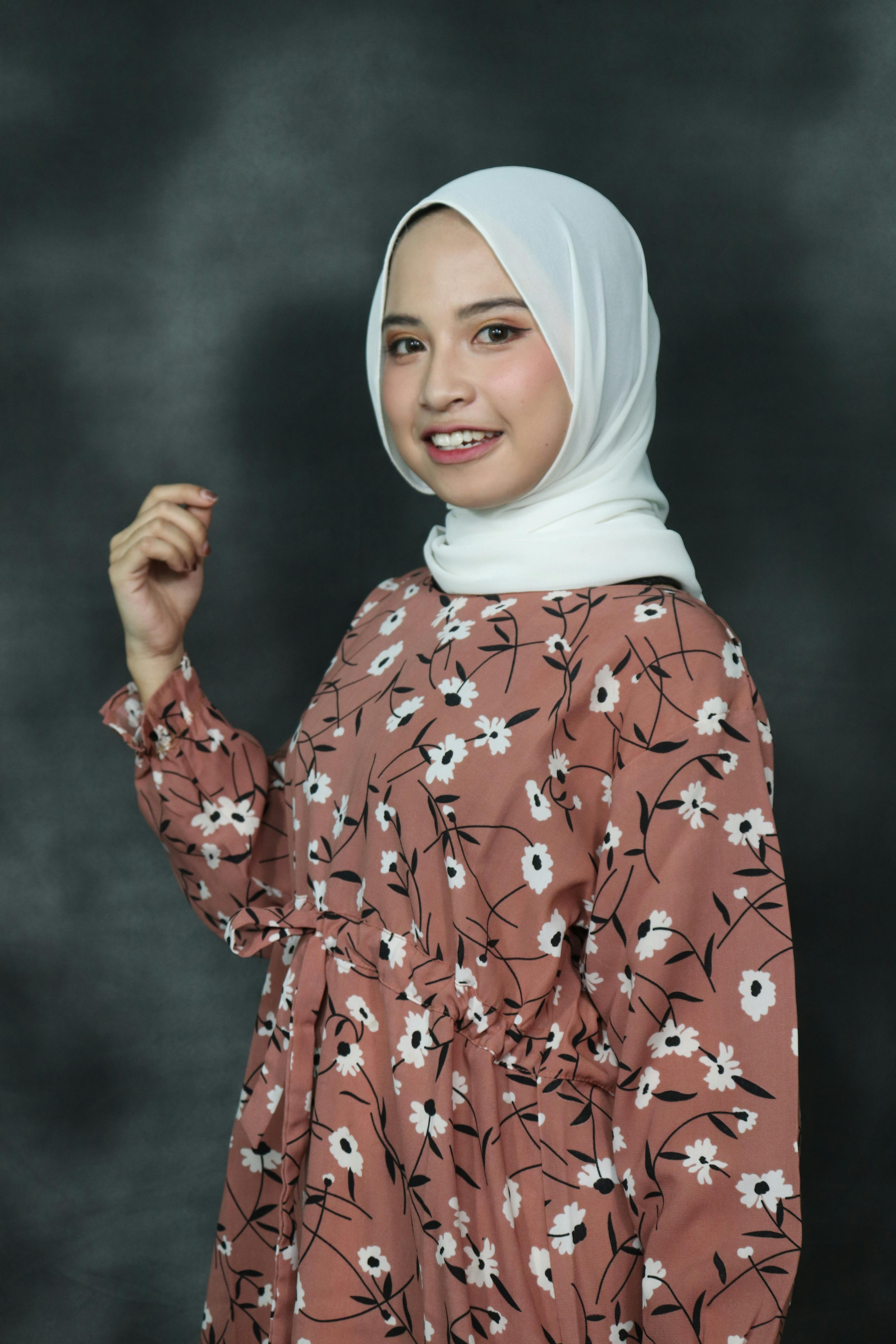 A Woman in Floral Dress Wearing White Hijab · Free Stock Photo
