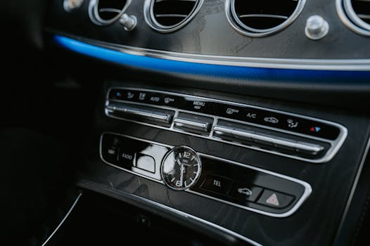 Detailed view of a vintage car dashboard highlighting the classic design and built-in clock.