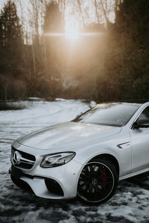 Mercedes Benz Car parked on Snow Covered Ground