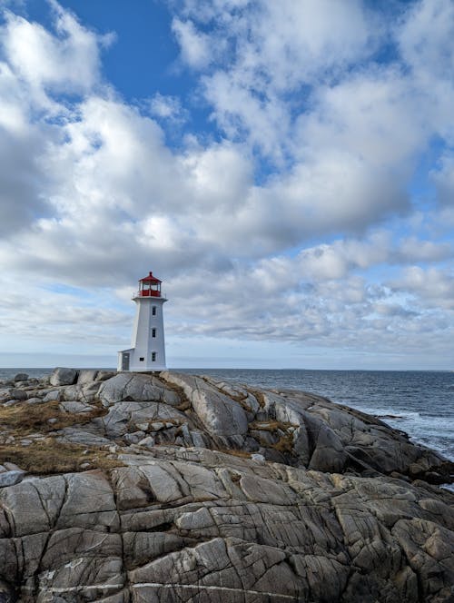 Lighthouse on Rocky Seashore