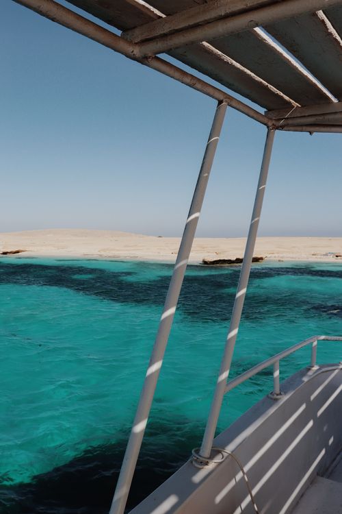 Free Discover the tranquil beauty of Hurghada's turquoise waters with a scenic boat view. Stock Photo