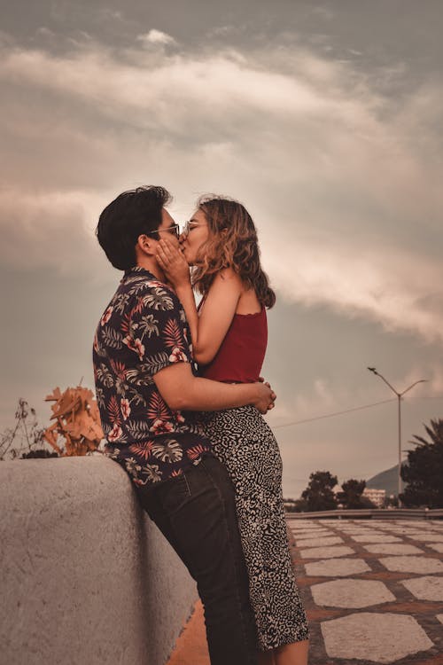 Couple Kissing on a Bridge 