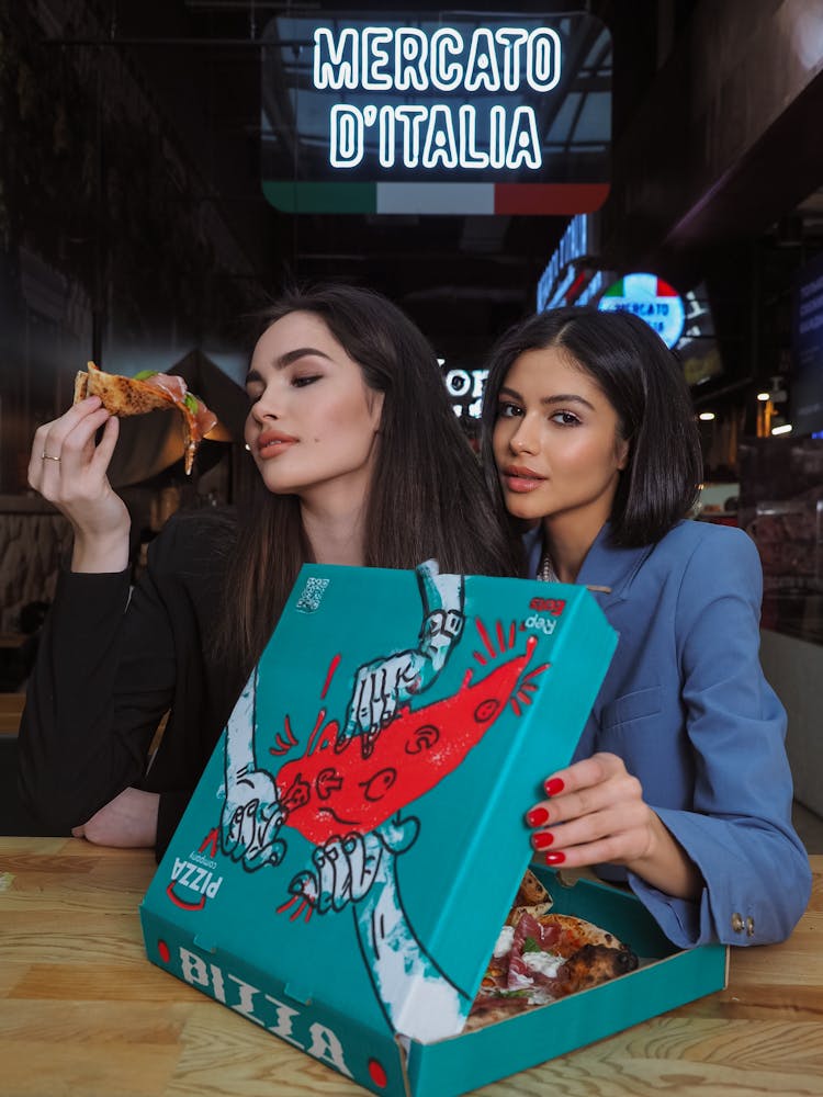 Women Eating Pizza