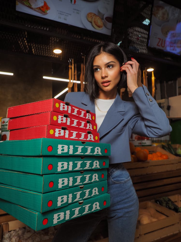 Woman Carrying Pizza Boxes