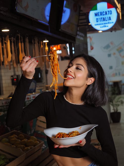 Free Woman Eating Pasta Stock Photo