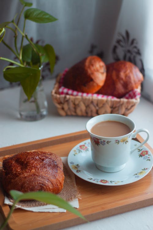 Free Croissant Beside a Cup of Coffee Stock Photo