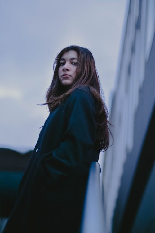 A Woman in Black Trench Coat