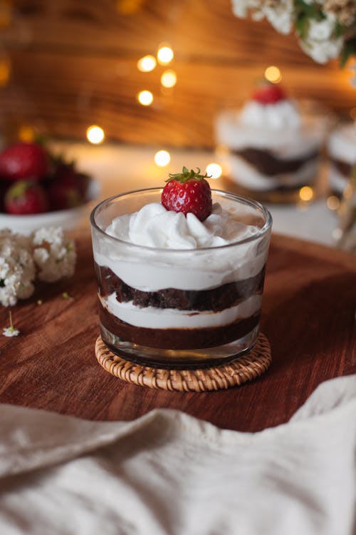 Chocolate Mousse and Whipped Cream Dessert Topped with Strawberry