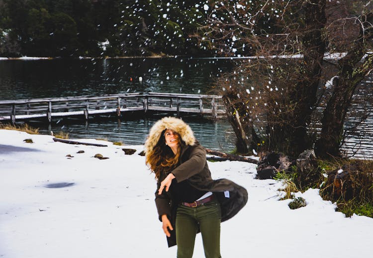 Woman Throwing Snow In The Air 