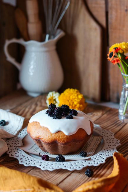 Close-up of a mouthwatering blackberry cake with icing, perfect for sweet tooth cravings.