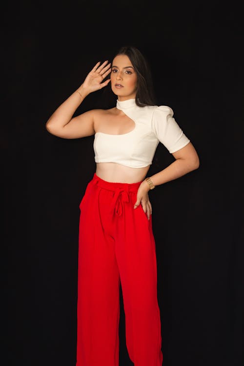 Free Photo  African american woman in red pants and white fur