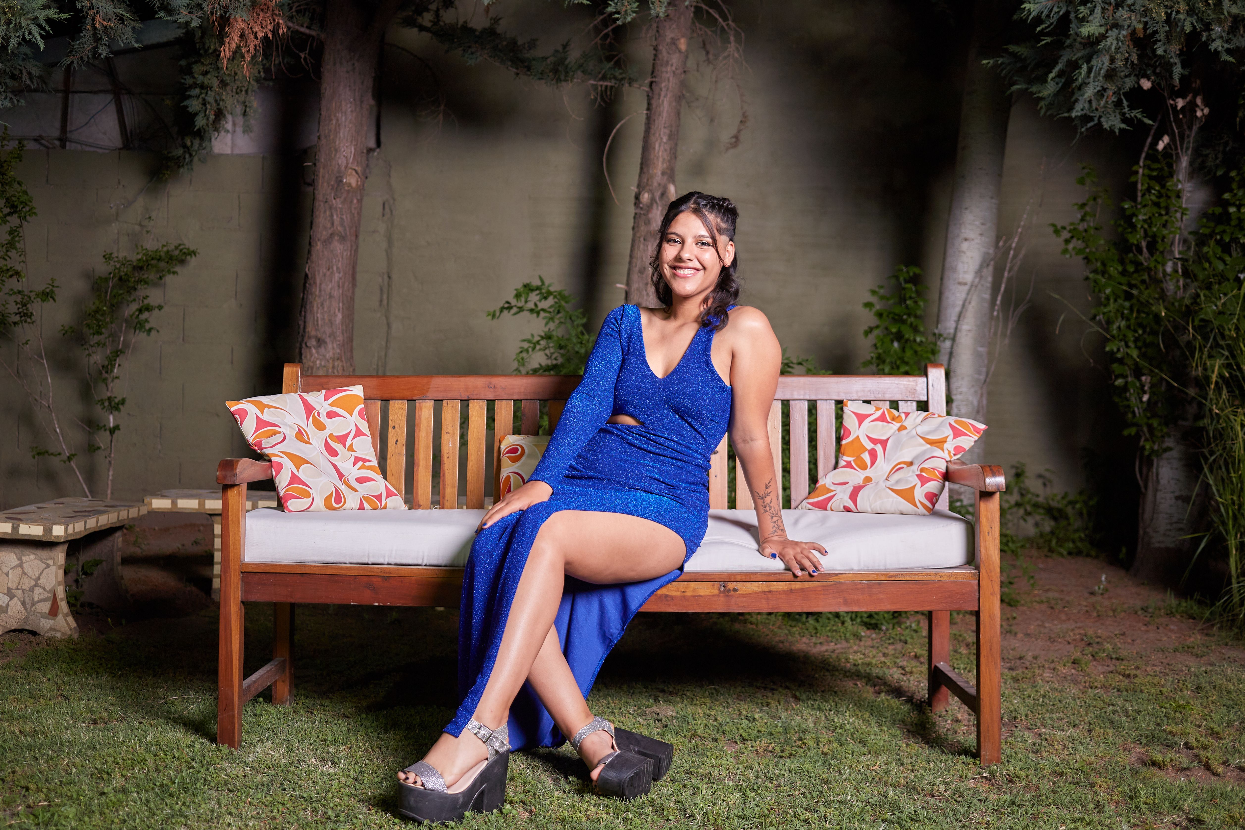 A Woman in Blue Dress Sitting on a Bench · Free Stock Photo