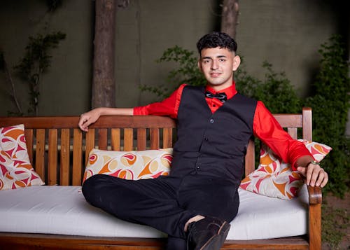 Good Looking Man in Red Long Sleeves Sitting on a Bench