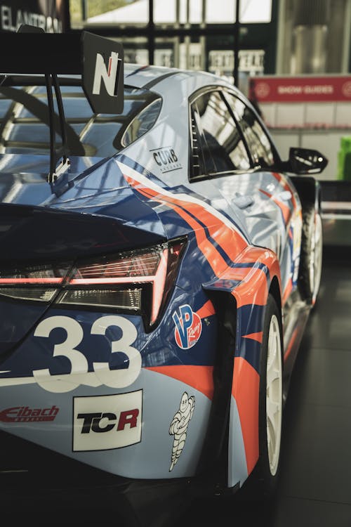 Close-Up Shot of Blue and Orange Racing Car